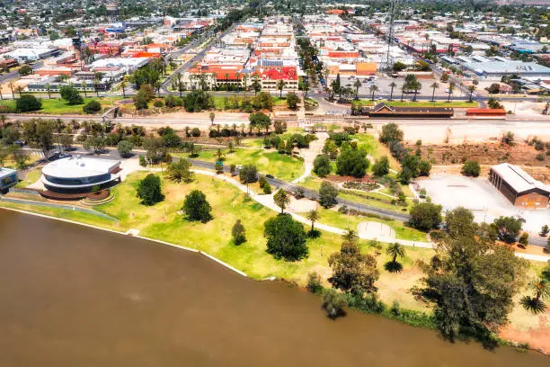 Waterfront of Mildura city on Murray river with train station and downtown - aerial cityscape.