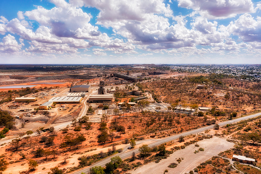 Open pit working lead and zinc mine in Broken Hill town of australian outback Far West - aerial cityscape.