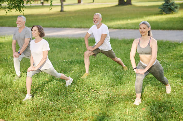 istock Group of people having a workout and doing lunges together 1364725770