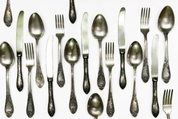 istock Set of vintage silver spoons and forks isolated on white background 1364731259