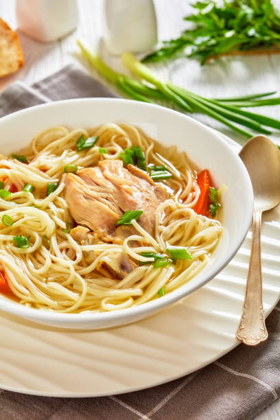 istock chicken noodle soup with carrots and scallion 1364733111