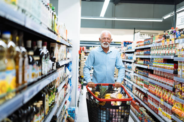 istock Retired man buying groceries 1364737893