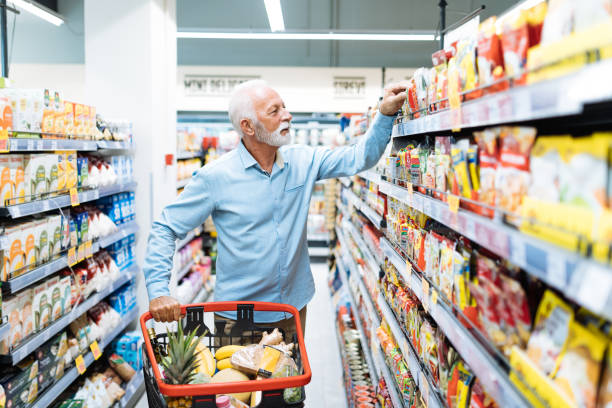 istock Retired man buying groceries 1364737968