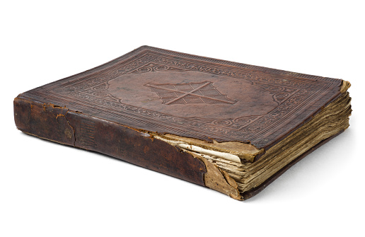 Antique bible with leather-bound cover.