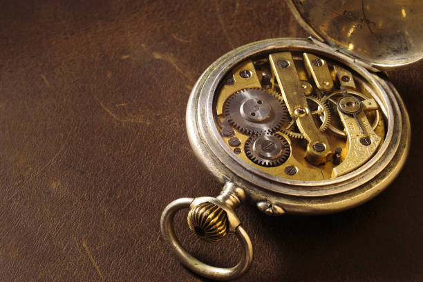 istock Ancient gears on the leather background. Old pocket watch. 1364738137