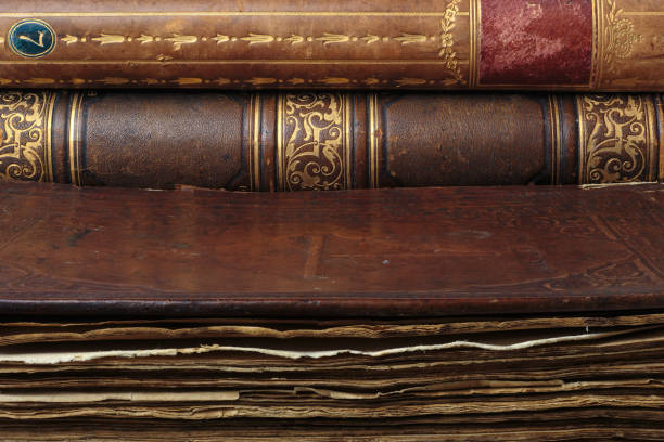istock Very old books in the library. Antique leather-bound book covers 1364739255