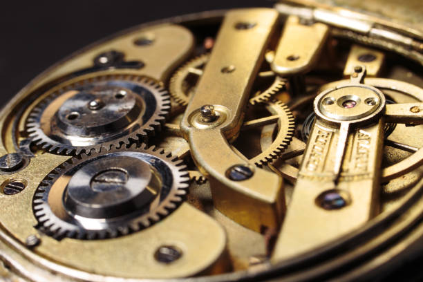 Old mechanical pocket watch. Clockwork gears wheels, close-up view. stock photo