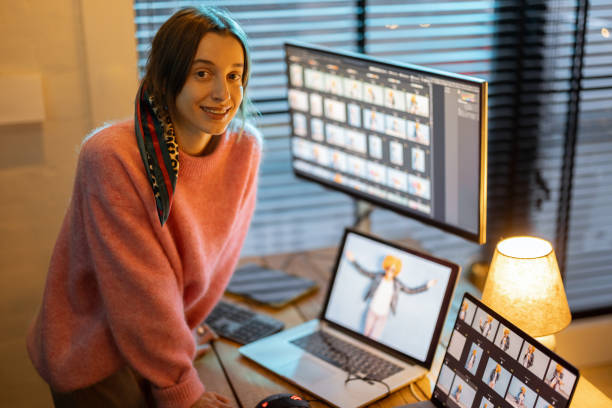 istock Photographer editing photos at home office 1364741275