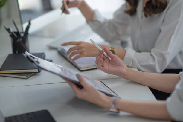 istock Young business team working with business report document on office desk. 1364741493