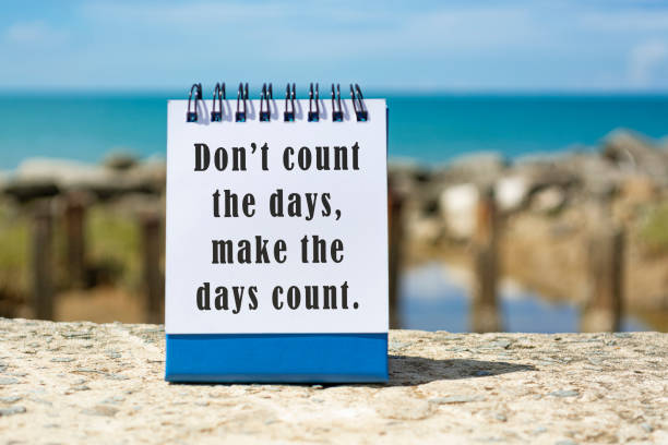 istock Motivational and Inspirational quote on a notepad with blurred beach background 1364742232