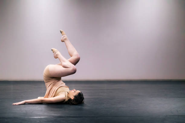 istock Young girl performing contemporary dance on stage 1364744502
