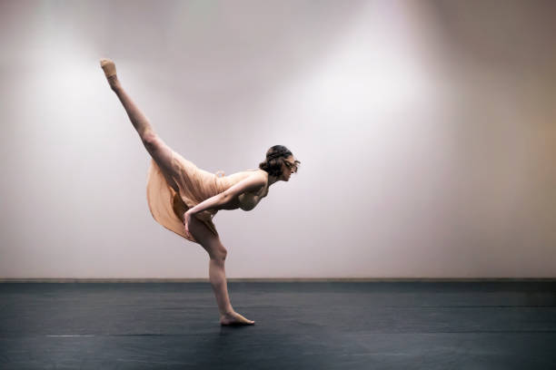 istock Young girl performing contemporary dance on stage 1364744504
