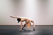 istock Young girl performing contemporary dance on stage 1364744514