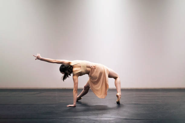 Young girl performing contemporary dance on stage Young girl performing contemporary dance on stage. Canon Mark IV. rehearsal photos stock pictures, royalty-free photos & images