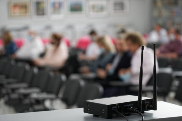 istock A multi-channel device for transmitting a signal to a wireless microphone installed in a business class, university or college. Modern wireless technologies 1364745257