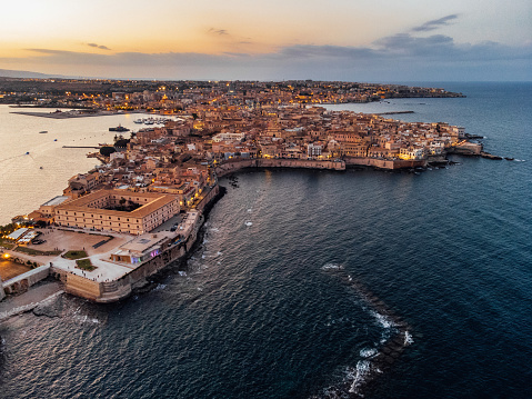 Aerial view of Ortigia Island and Siracusa city at sunset