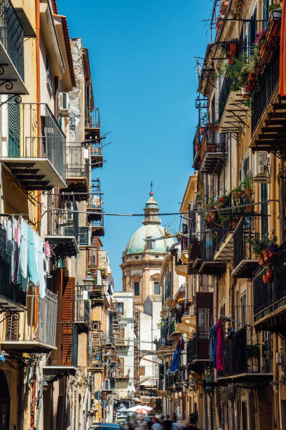 istock Street in Palermo with a dome in the background 1364745564