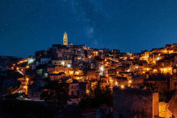 istock Sassi di Matera panoramic view at night with stars in the sky 1364746409