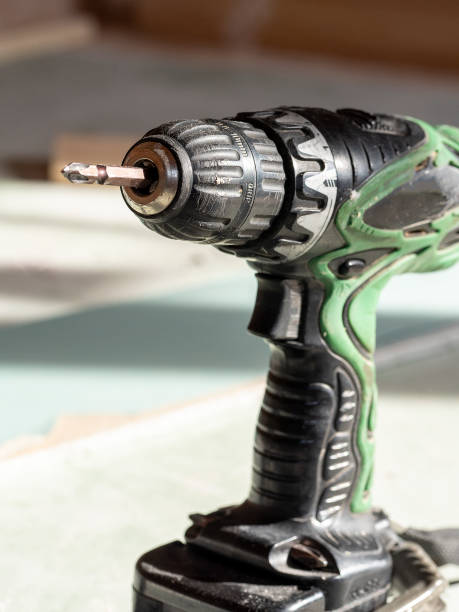 istock old dirty electric screwdriver on batteries is in the workshop on the material 1364747908