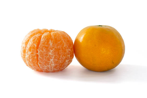 Whole Tangerine or Orange fruit and peel isolated on white background included clipping path.