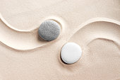 Round stones on a sandy background