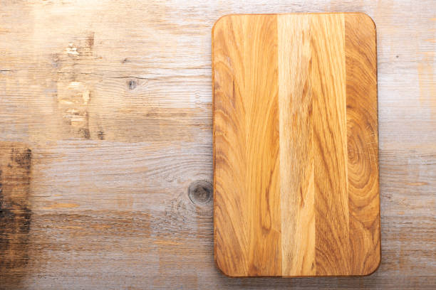 istock Chopping kitchen boards on a wooden background. Top view flat lay. 1364750942