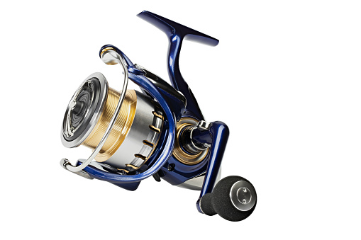 Fishing reel isolated on a white background. Fishing tackle of the premium segment. Spinning reel. File contains clipping path.