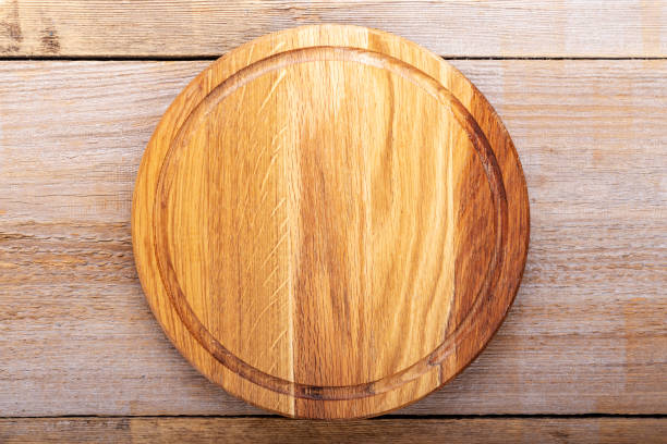 istock Chopping kitchen boards on a wooden background. Top view flat lay. Space for text. 1364750965