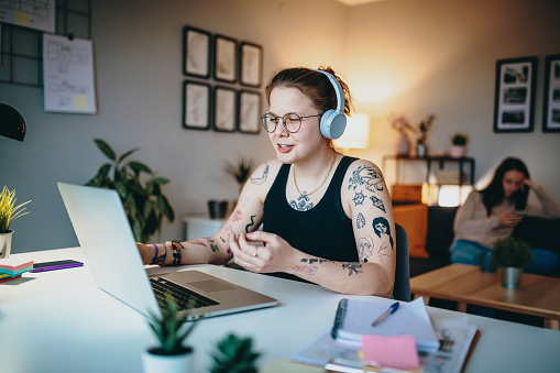 Lesbian woman working from home on laptop