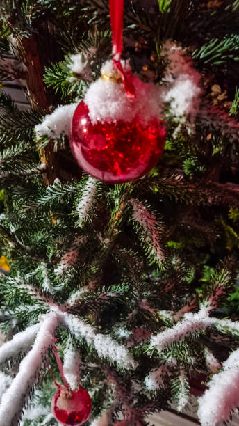 istock Red snowed Christmas balls on the fir tree 1364752131