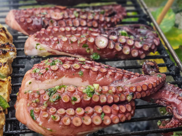 istock Close-up view of fresh octopus on the grill. 1364753077