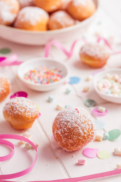 istock Krapfen, Berliner and donuts with streamers and confetti 1364753103