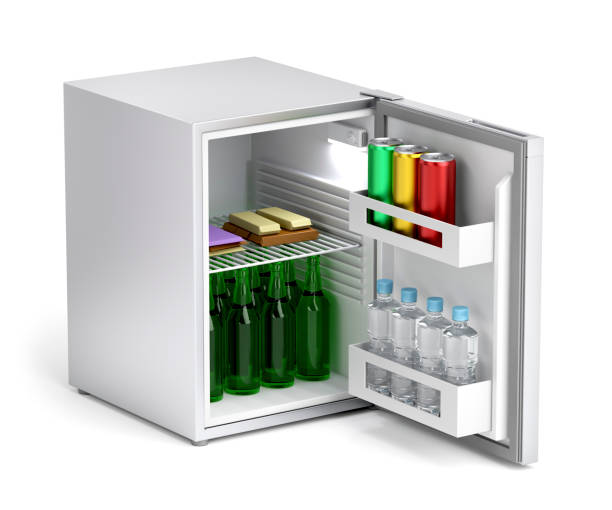 Minibar refrigerator with drinks and snacks stock photo