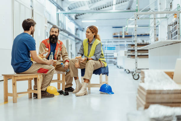 istock Teamwork in industry, employees eating breakfast 1364754086