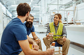 Teamwork in industry, employees eating breakfast