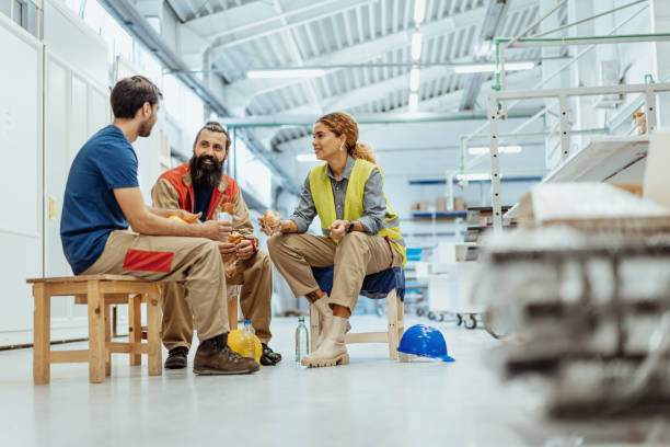 istock Teamwork in industry, employees eating breakfast 1364754105