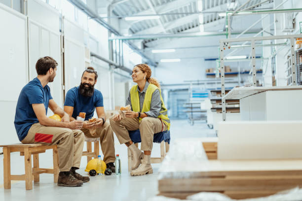 istock Blue collar workers eating breakfast during the shift break in factory 1364754107