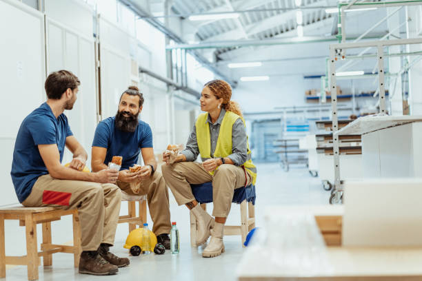 istock Blue collar workers eating breakfast during the shift break in factory 1364754114