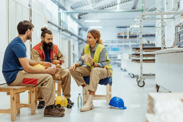 istock Teamwork in industry, employees eating breakfast 1364754115