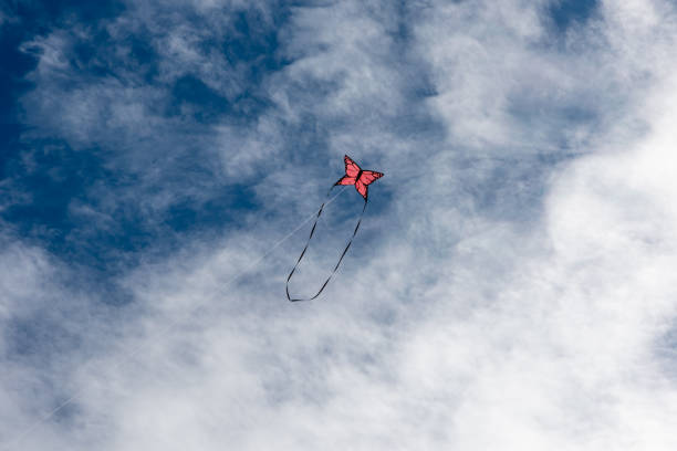 istock Colorful Kites flying over the sky 1364757381