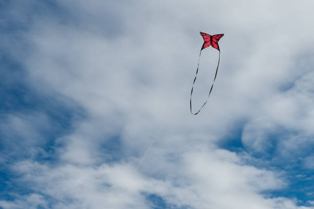 istock Colorful Kites flying over the sky 1364758438