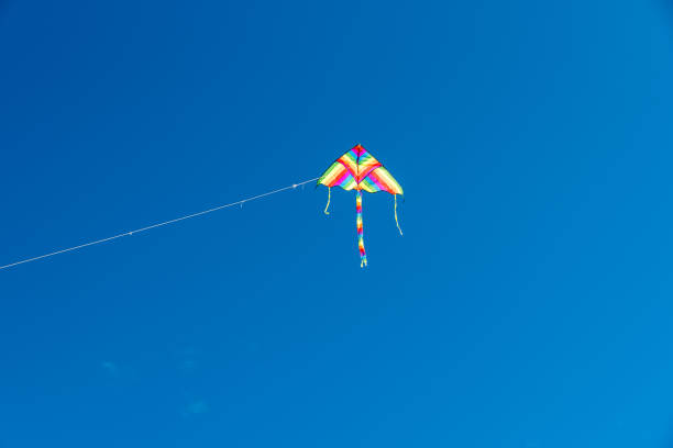 istock Colorful Kites flying over the sky 1364758641
