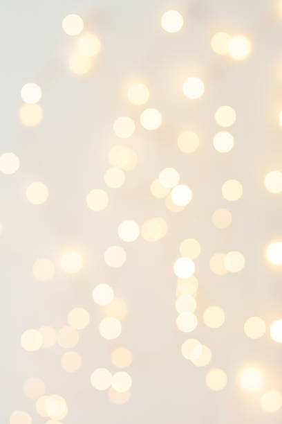 istock Background with abstract golden sparkling christmas lights. Bokeh effect. Defocused. Template for holiday card 1364758861