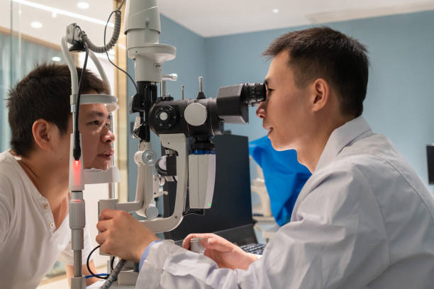 istock Ophthalmologist is using instrument to examine patient's eyes 1364760688