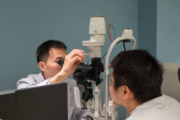 istock Ophthalmologist is using instrument to examine patient's eyes 1364760783