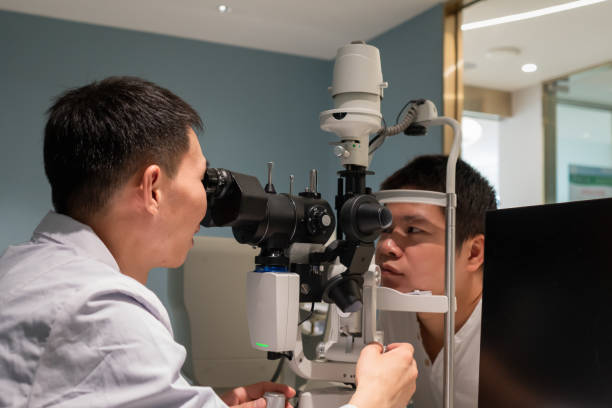 istock Ophthalmologist is using instrument to examine patient's eyes 1364760842