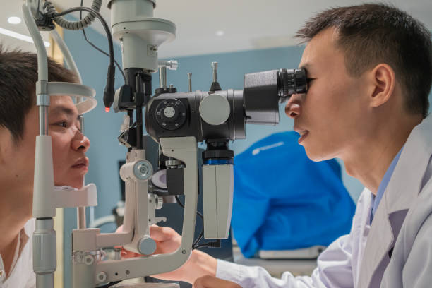 istock Ophthalmologist is using instrument to examine patient's eyes 1364760920