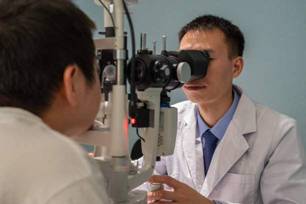 istock Ophthalmologist is using instrument to examine patient's eyes 1364760937