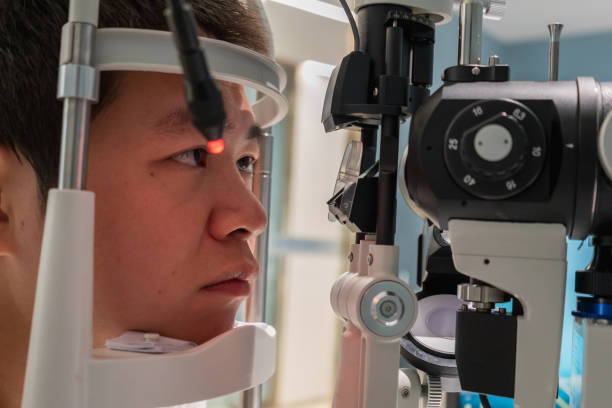 istock Ophthalmologist is using instrument to examine patient's eyes 1364761020