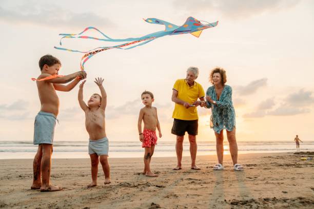 istock Grandfather playing with grandchildren 1364761571